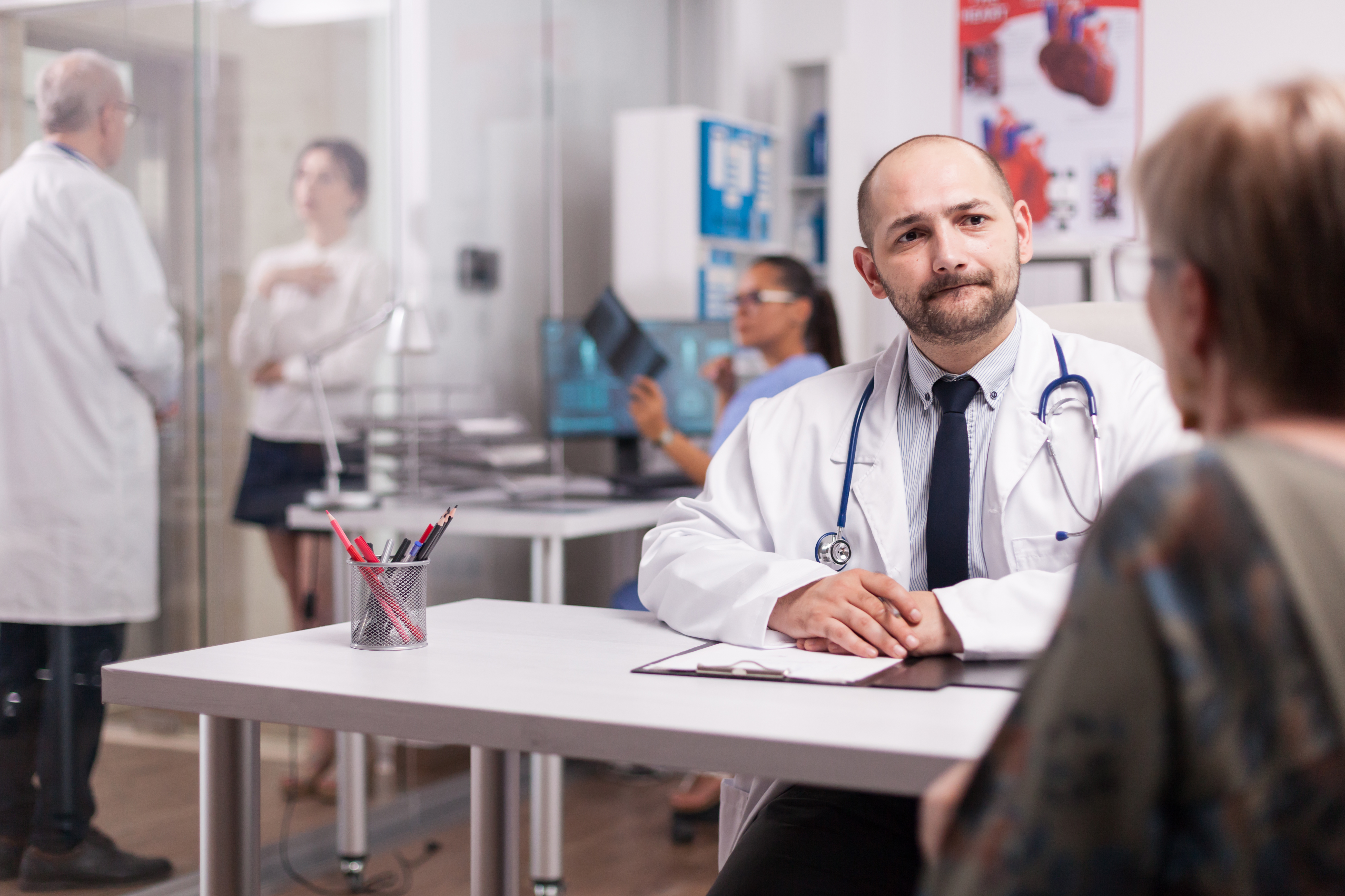 Young Doctor Discussing Stem Cells and Other Biologic Solutions with Patient